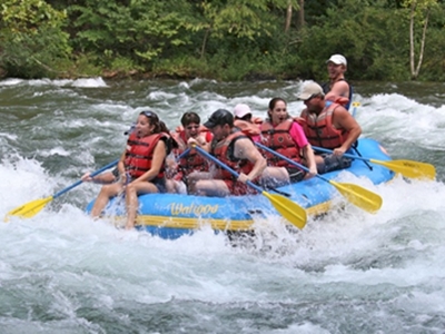 Photo of group in raft on river